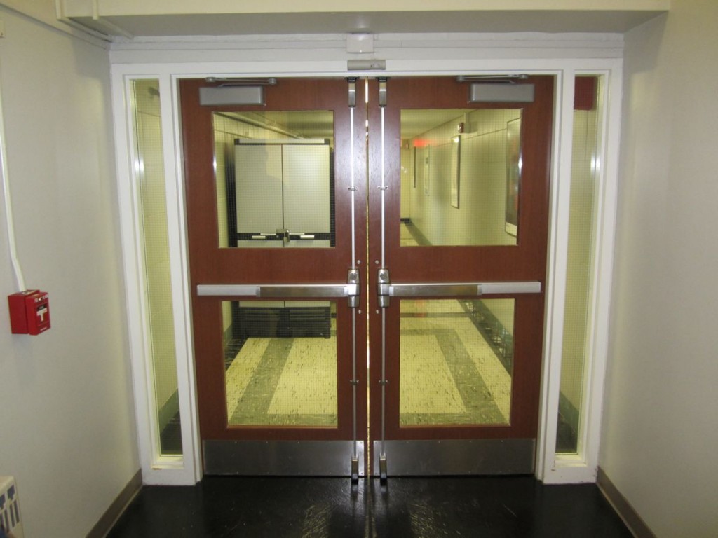 These doors were installed within the last six months and contain traditional wired glass, even though the doors are not fire-rated and the code requires impact-resistant glass in all doors.