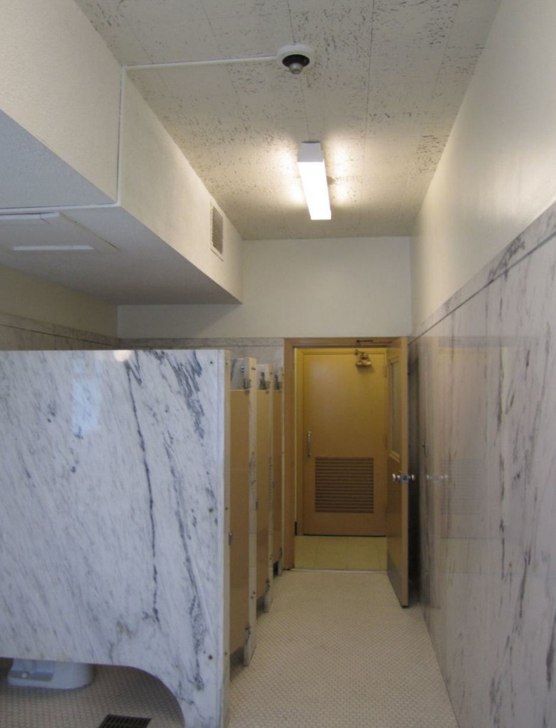 If an automatic operator is installed to overcome a maneuvering clearance issue on the egress side, the 2010 ADA requires standby power for the operator.  Photo: SAS Architects