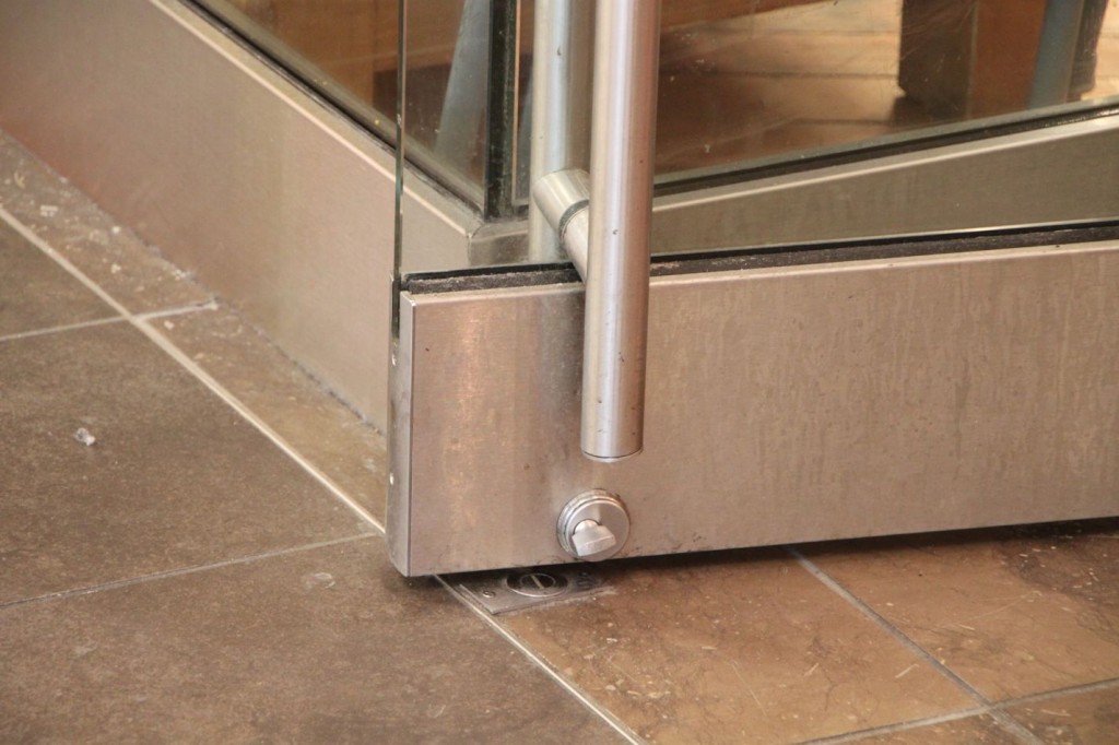 Protruding hardware within the bottom 10 inches of a door opening could inhibit passage through a door opening by catching a crutch, cane, walker, or wheelchair. 