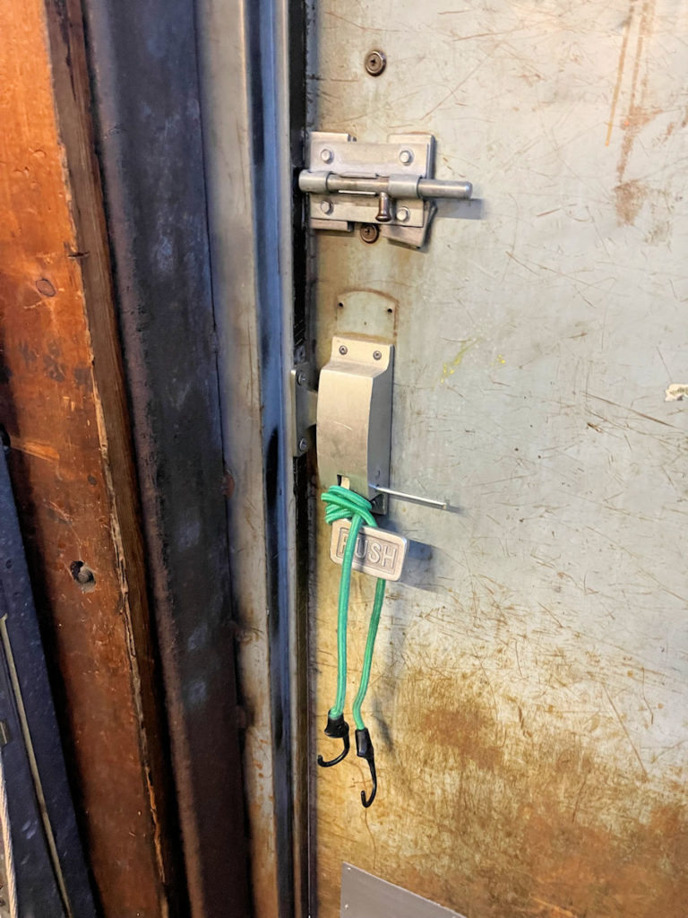 bungee cord around egress handle