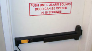 delayed egress lock - push until alarm sounds, door can be opened in 15 seconds