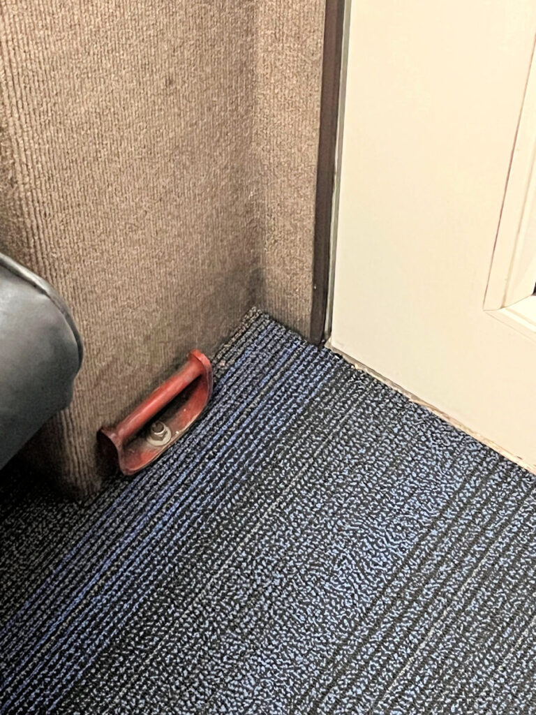 metal handle on carpet