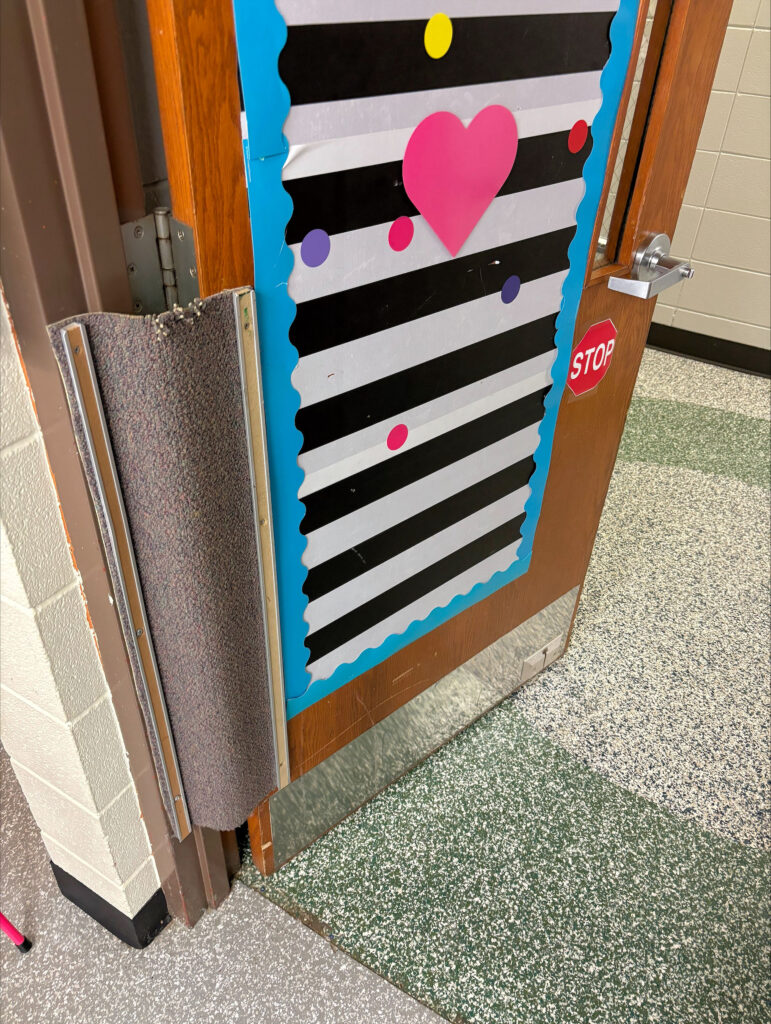 Custom finger guard in classroom door