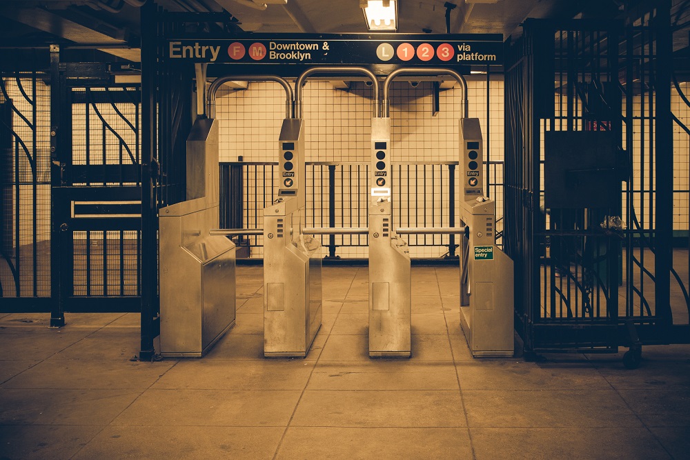 I recently received a link from a New York City architect and public transportation commuter to a news article about a plan to use delayed egress locks on subway gates.  Thoughts?