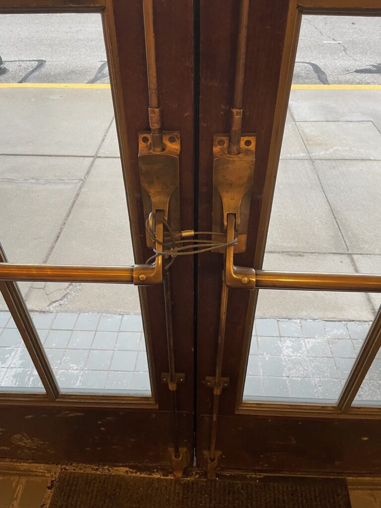 Marc Zolner of Allegion sent me today's Fixed-it Friday photo, and he asked what the codes say about having one pair locked with a cable, with four other pairs available for egress.
