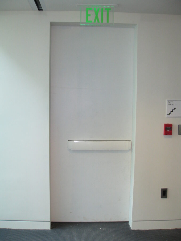 White door and panic against white wall