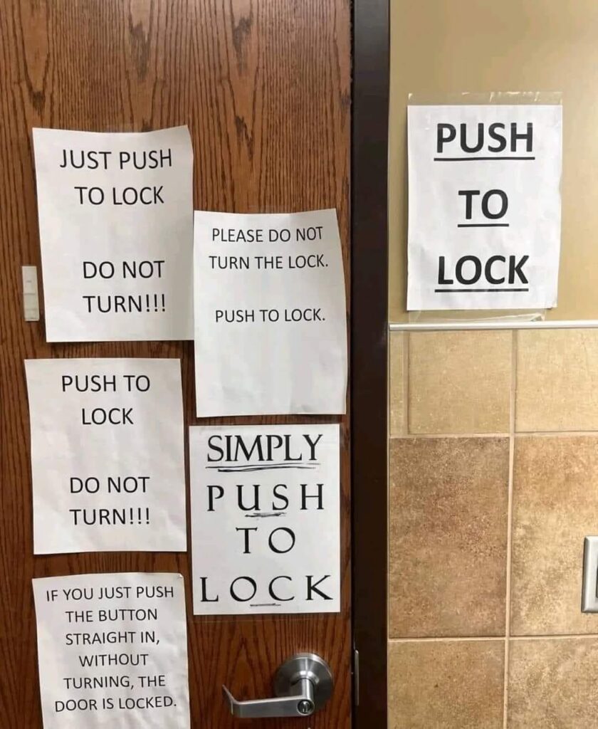 Door with multiple push to lock signs