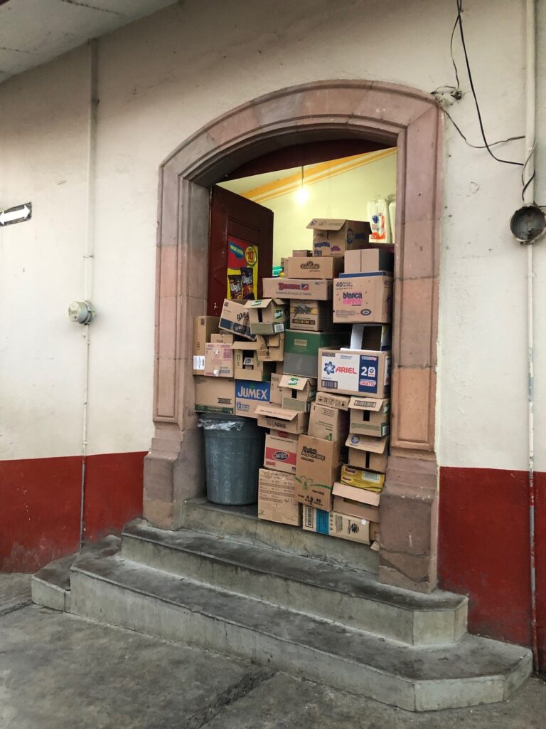 The inability to maintain clear egress routes in retail occupancies crosses international borders.  I saw this example in Tlalpujahua, a Pueblo Mágico in Mexico that is known for its hand-painted Christmas ornaments.