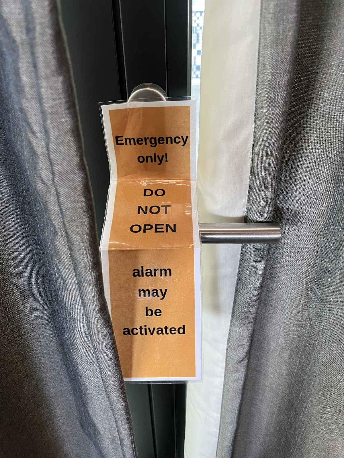 English sign not to open door in an Amsterdam store