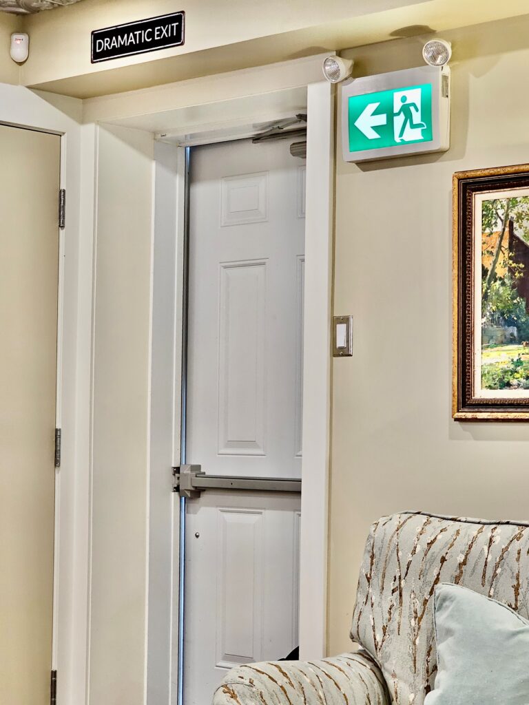 Chris Clark sent me today's Fixed-it Friday photo, taken in a cafe in Canada.  I'm curious...what makes this a dramatic exit?  Any theories?