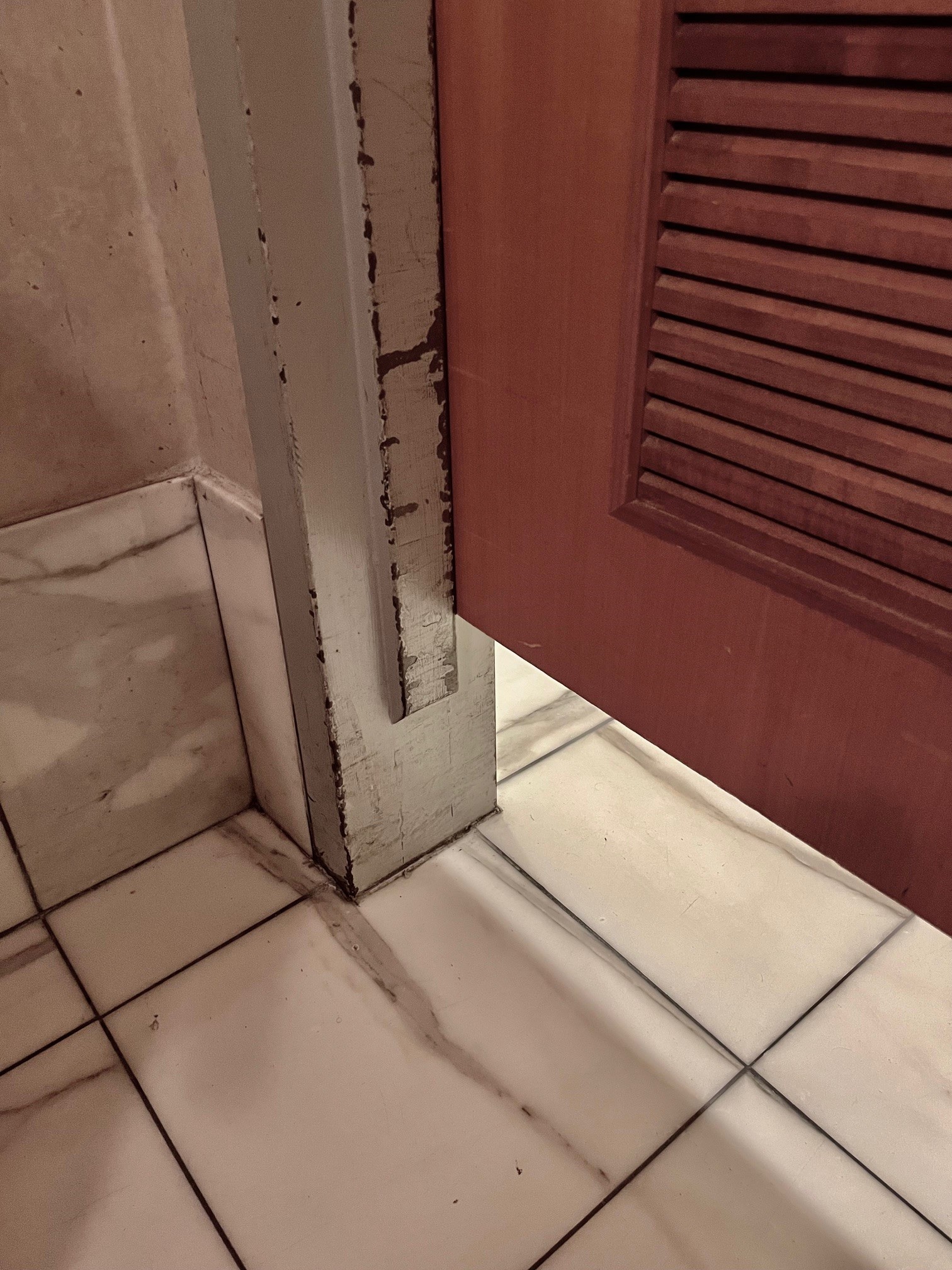 Terminated stop on a bathroom door