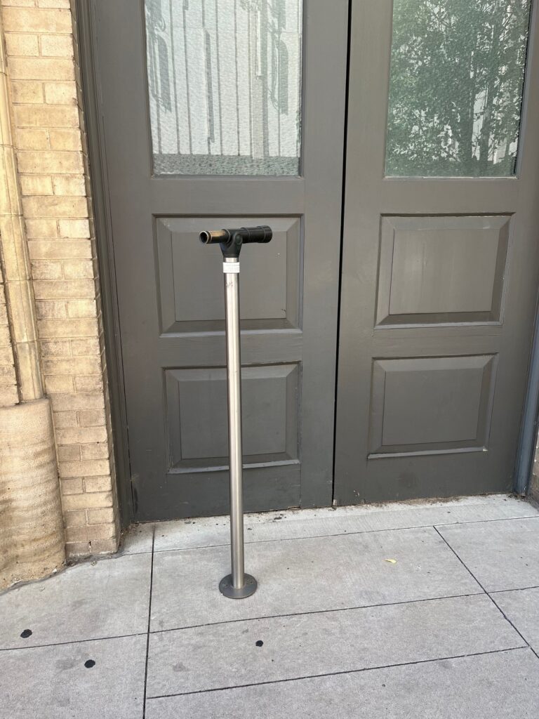 I saw this door in the Theater District in Denver, with an art project preventing the door from opening.  I'm assuming the door is no longer used...I wonder what it looks like from the inside.