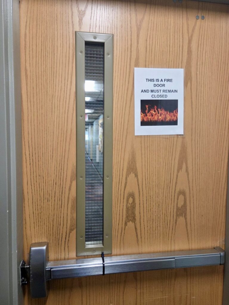 Adam Fisk of Allegion sent me today's Wordless Wednesday photo...it's kind of ironic that someone went to the effort to make a sign for this fire door, which is equipped with zip tie dogging.