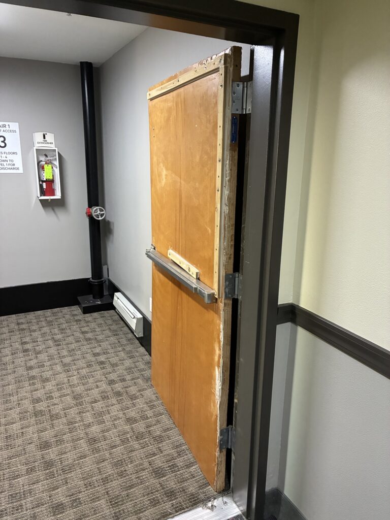 Michael Metzen of Walsh Door and Security sent me today's Wordless Wednesday photos of a hotel fire door, and these might take the cake for the worst WW fire door ever!