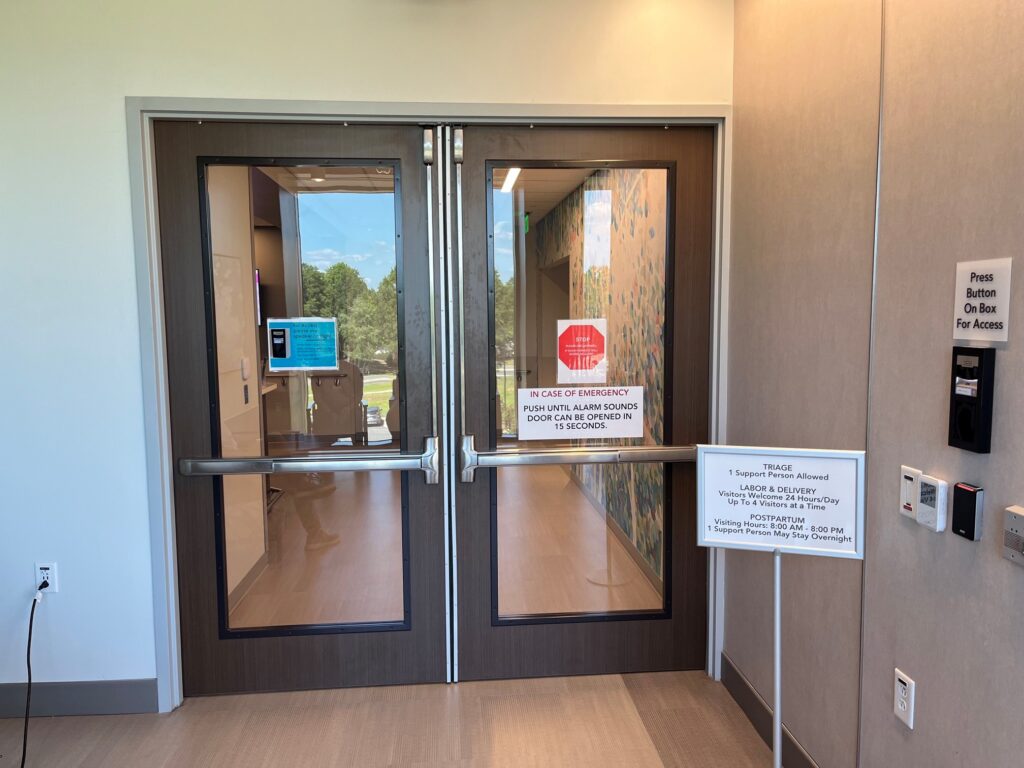 Apparently delayed egress leading through the maternity area of a hospital was not a popular choice - today's Fixed-it Friday photos are a great example of security vs. egress.