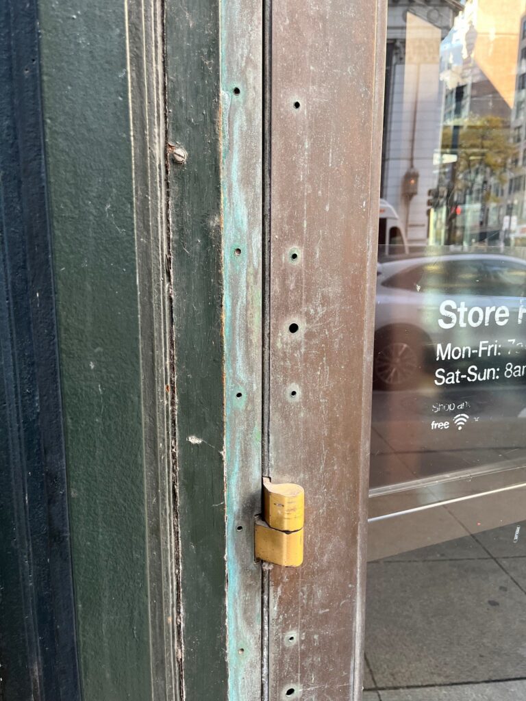 Last week I shared some photos of the beautiful brass/bronze doors of Chicago, and during one of my walks I noticed a Fixed-it Friday repair that made me cringe. 