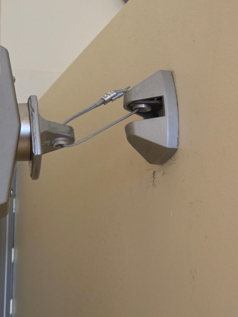 Today's Fixed-it Friday photo came from Graem Kubin of DuPage Security Solutions, and shows an electromagnetic holder that has been modified in a way that voids its listing. 